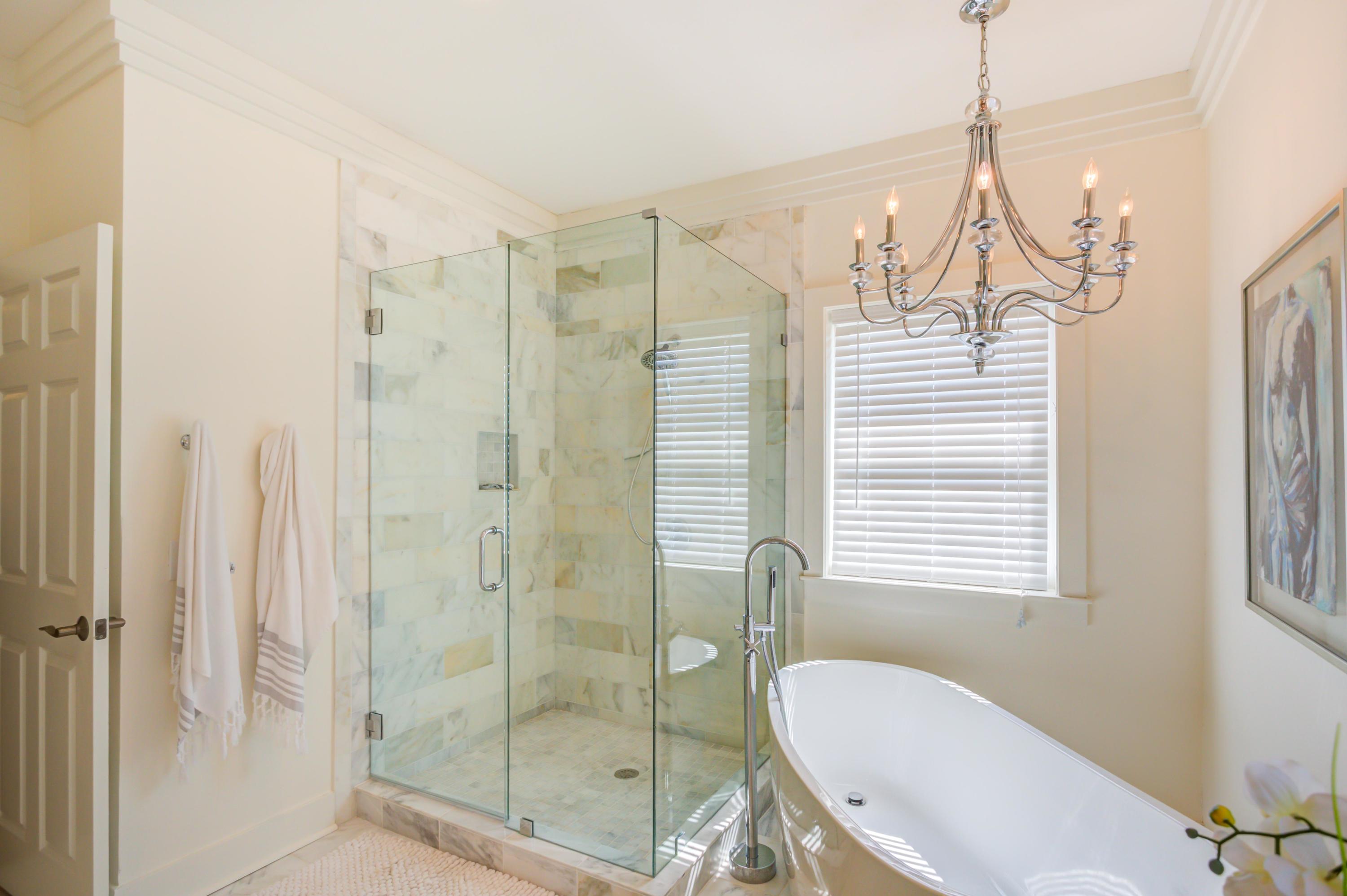 523 Gulf Shore Drive Destin, FL 32541 - Photo 25 of 78 a bathroom with a shower a sink and a window