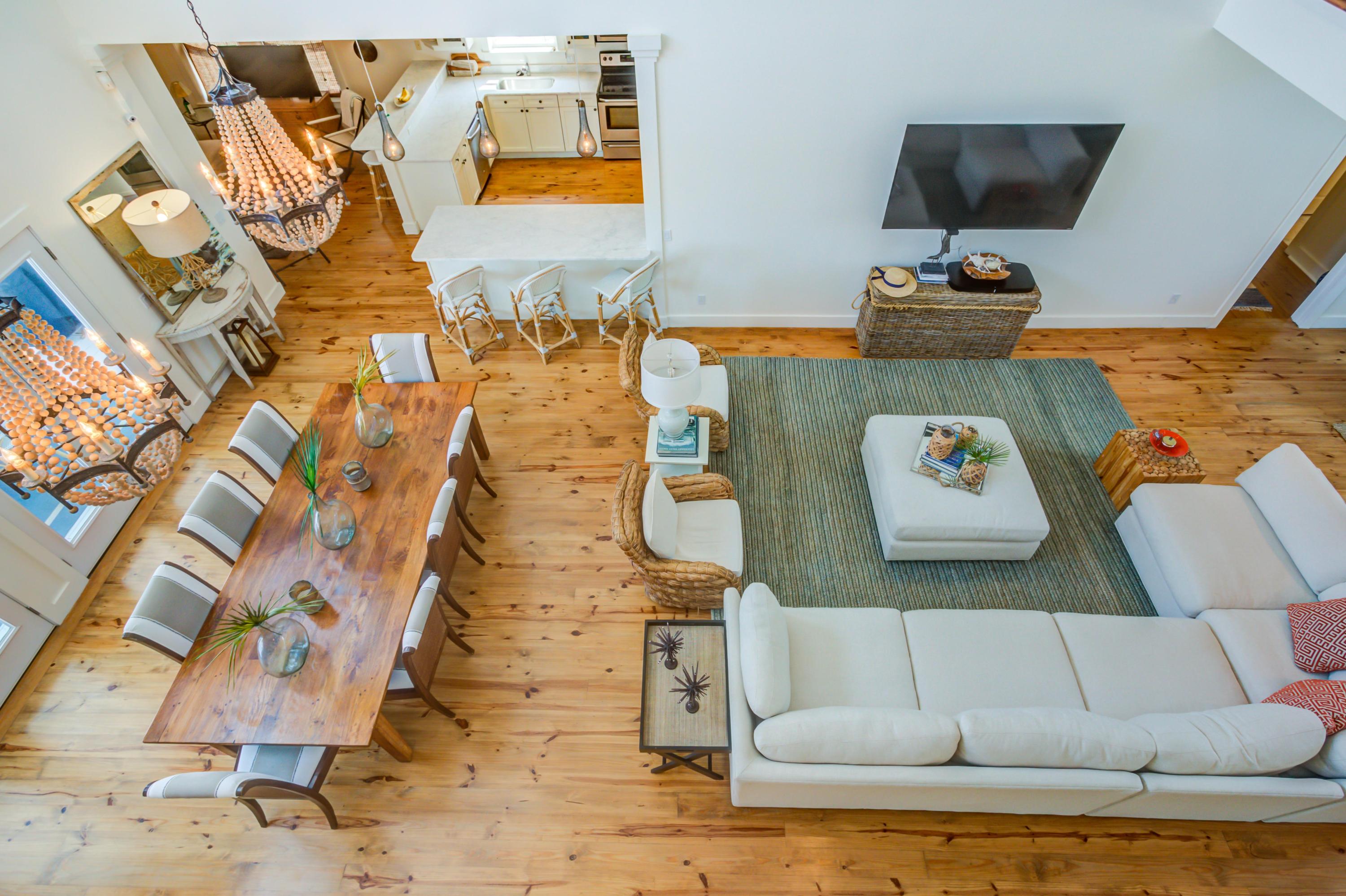 523 Gulf Shore Drive Destin, FL 32541 - Photo 27 of 78 a living room with a couch and a flat screen tv