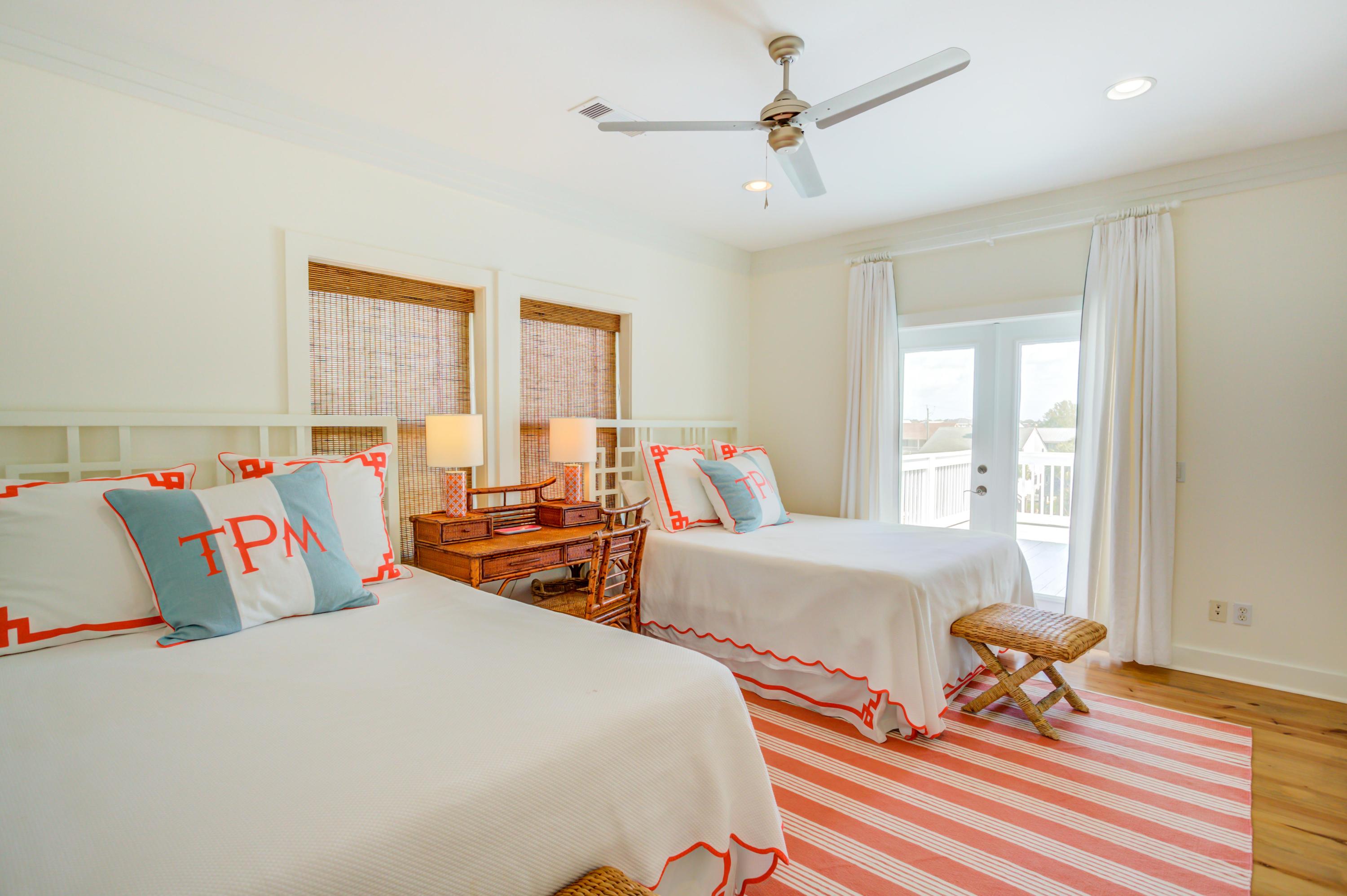 523 Gulf Shore Drive Destin, FL 32541 - Photo 29 of 78 a bedroom with two beds and a window