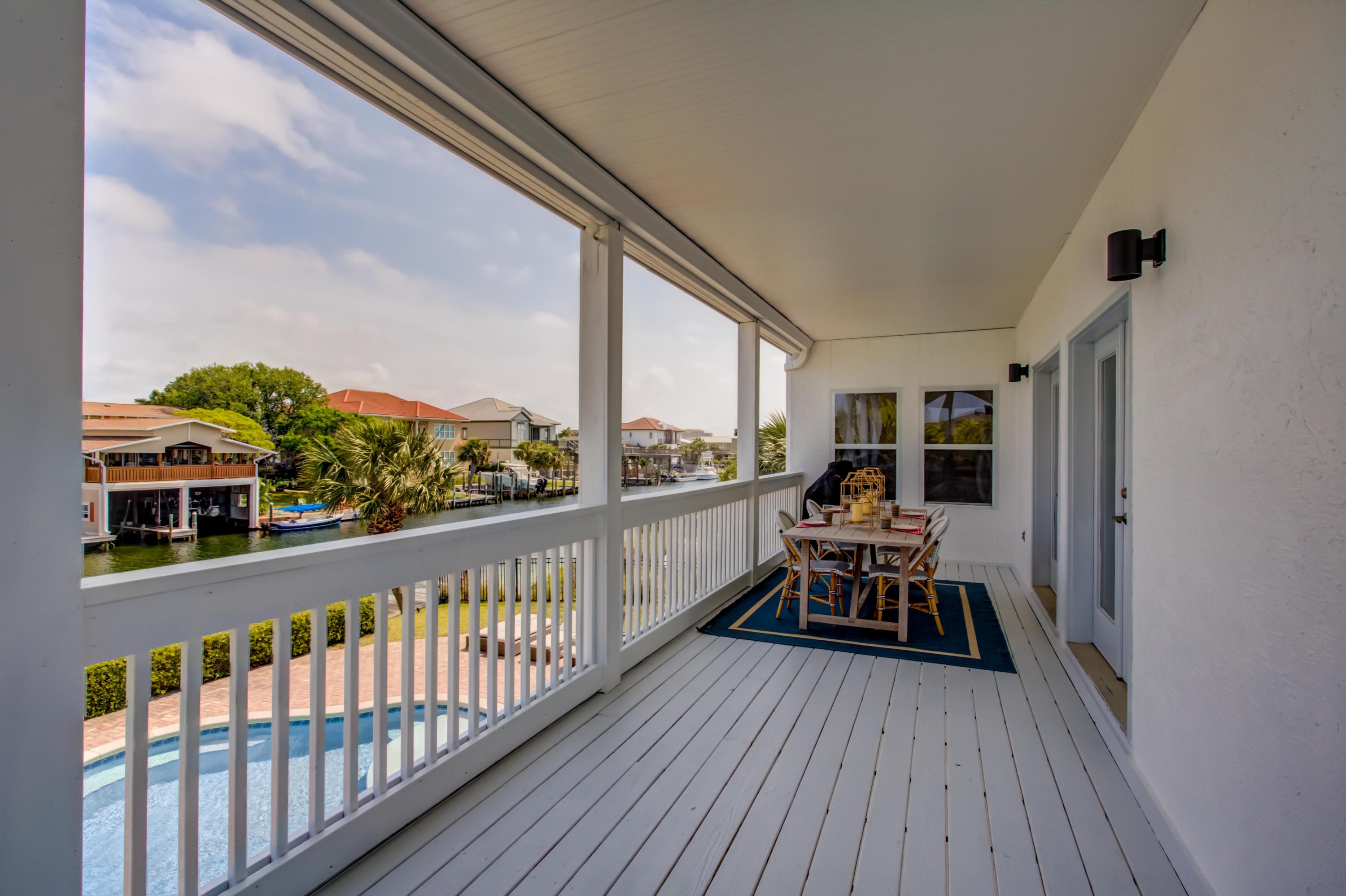 523 Gulf Shore Drive Destin, FL 32541 - Photo 40 of 78 a view of a balcony with chairs