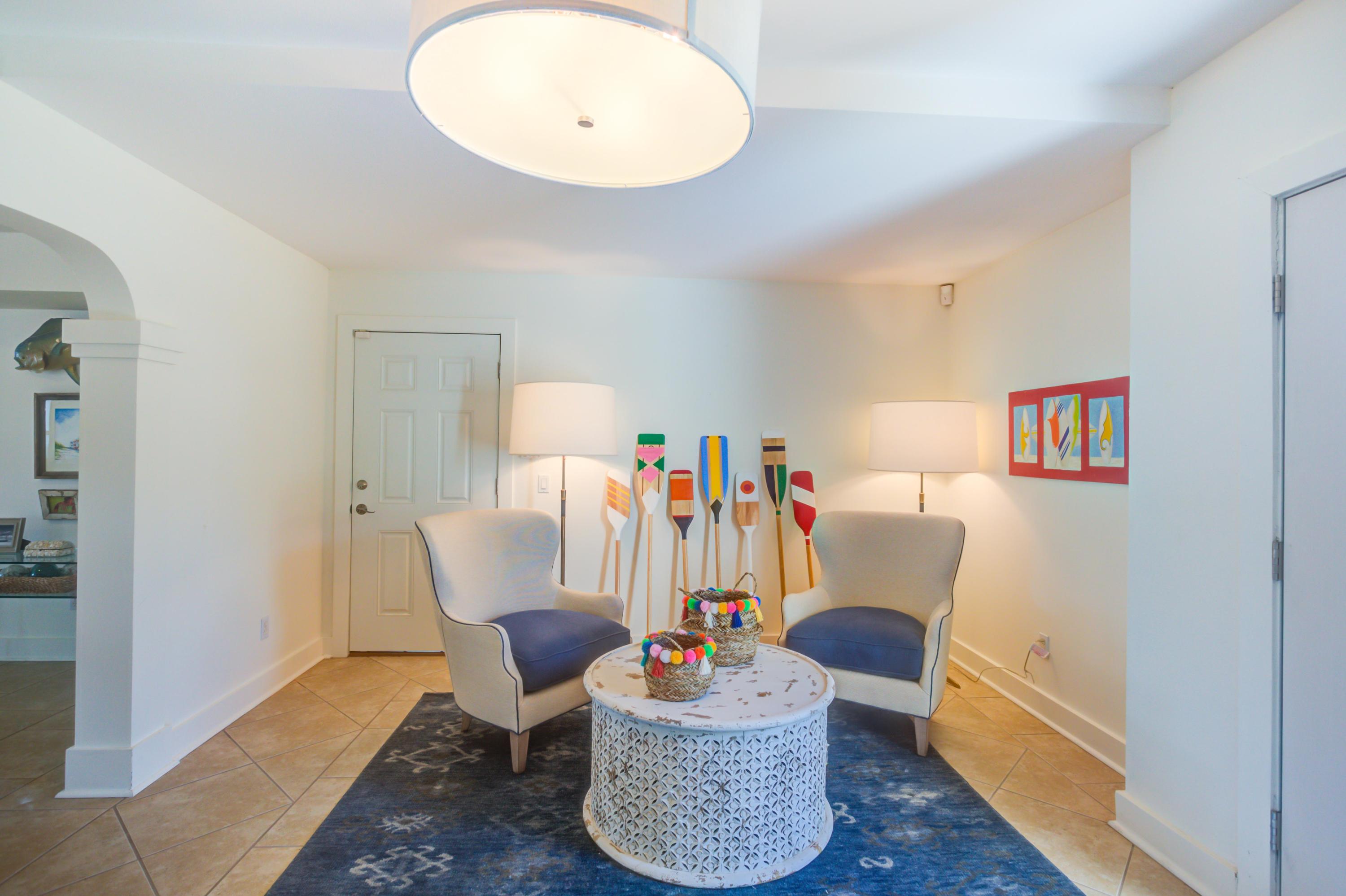 523 Gulf Shore Drive Destin, FL 32541 - Photo 45 of 78 a living room with furniture and a wooden floor
