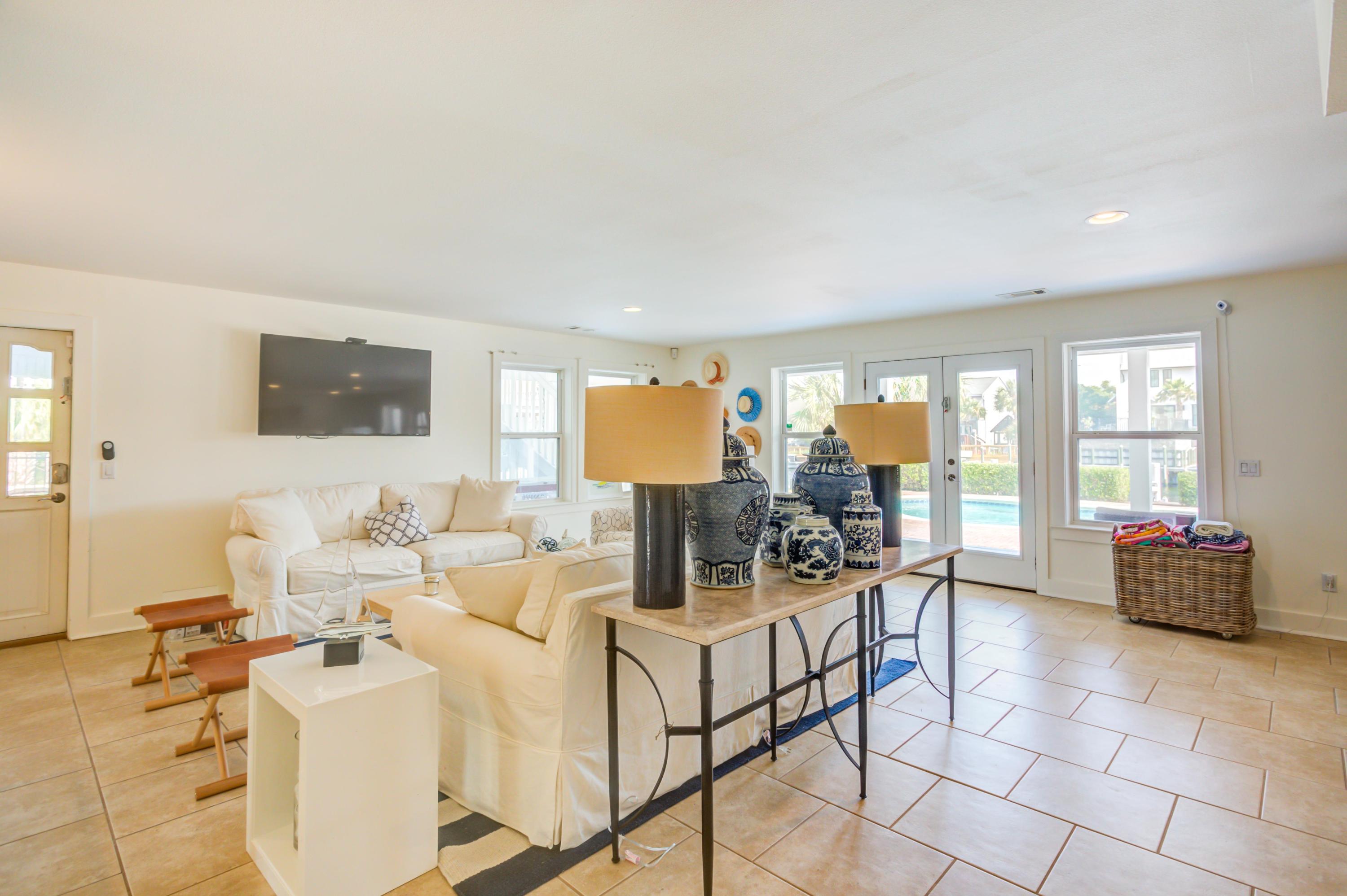 523 Gulf Shore Drive Destin, FL 32541 - Photo 48 of 78 a living room with furniture and large windows