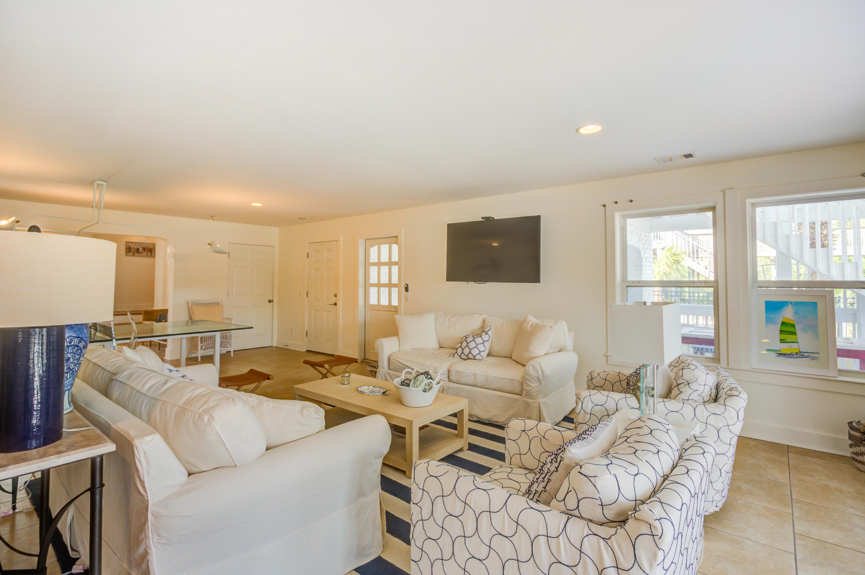 523 Gulf Shore Drive Destin, FL 32541 - Photo 49 of 78 a living room with furniture wooden floor and a window