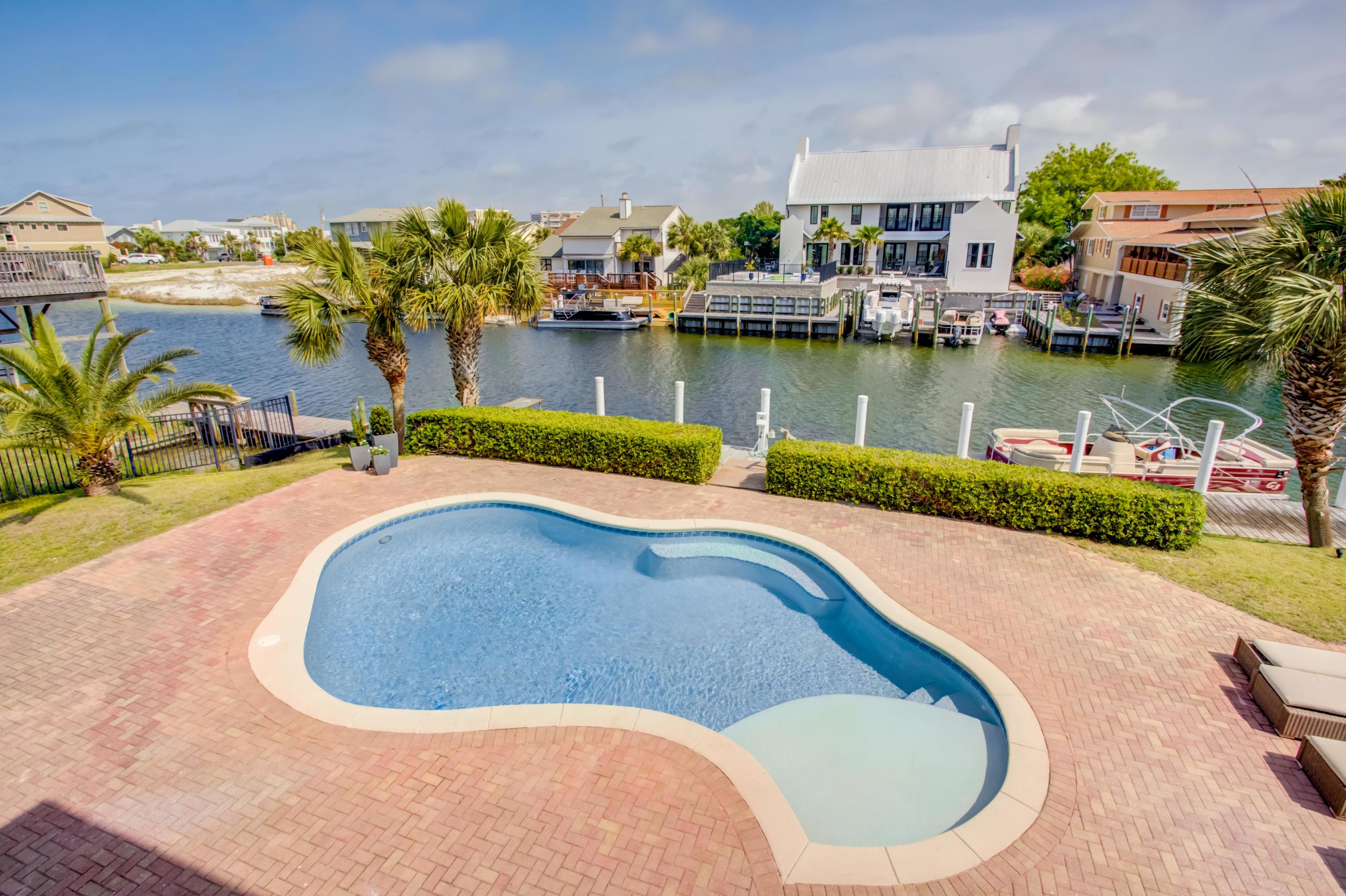 523 Gulf Shore Drive Destin, FL 32541 - Photo 5 of 78 an aerial view of a house with outdoor space swimming pool and lake view