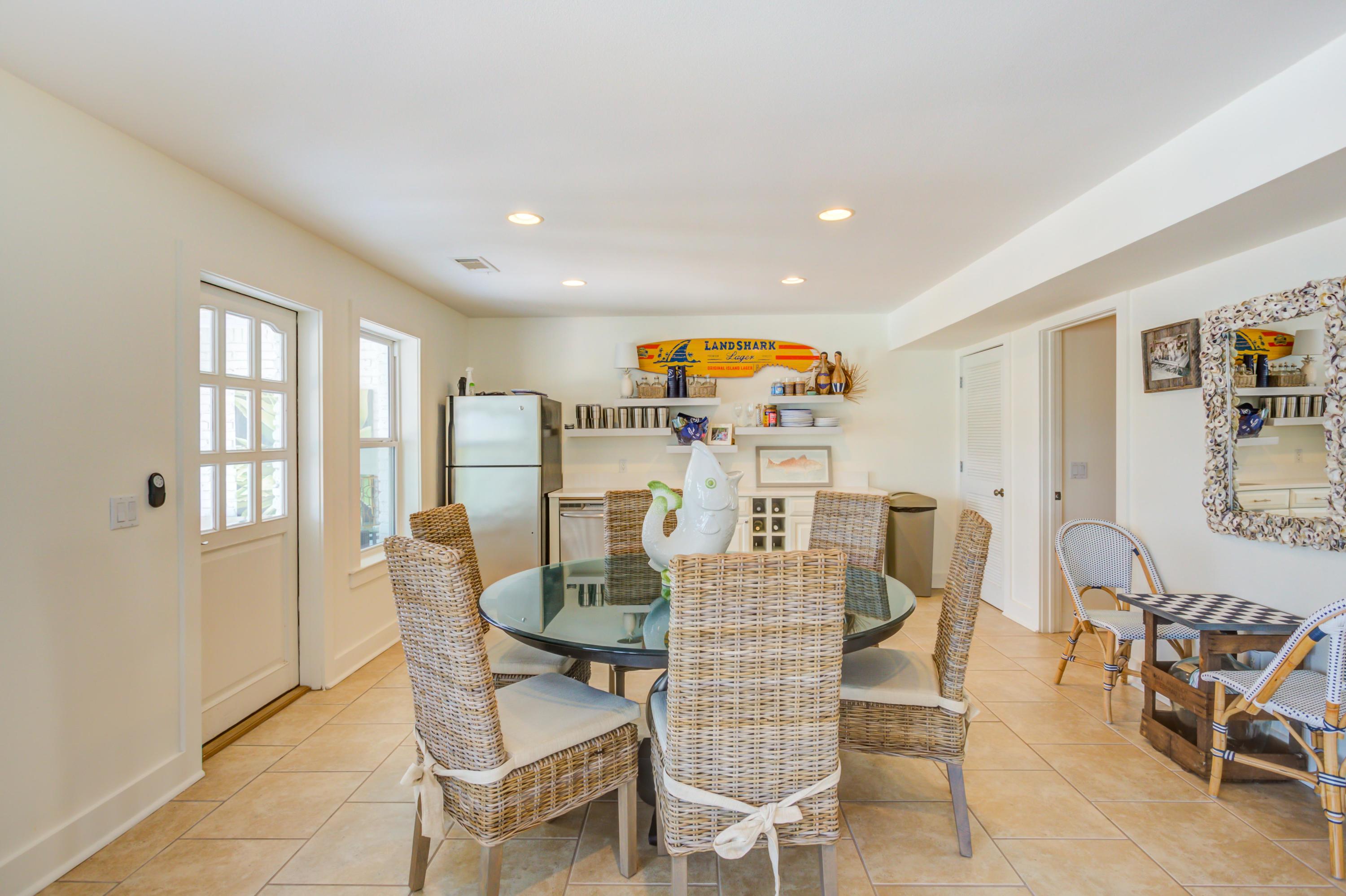 523 Gulf Shore Drive Destin, FL 32541 - Photo 51 of 78 a view of a dining room with furniture and a potted plant