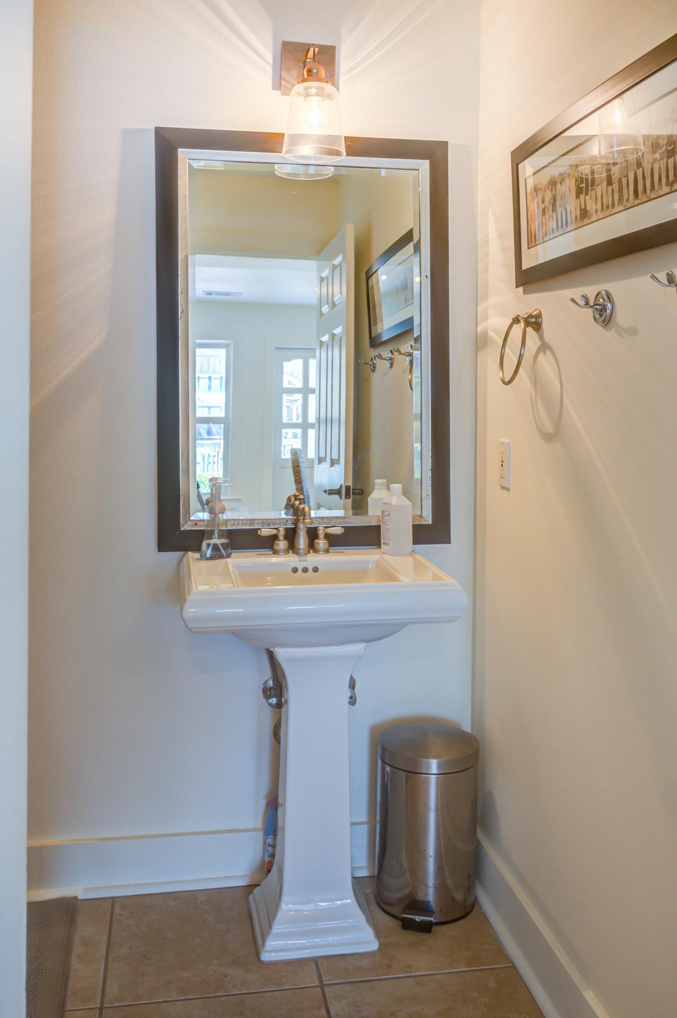 523 Gulf Shore Drive Destin, FL 32541 - Photo 54 of 78 a bathroom with a sink a mirror and a toilet