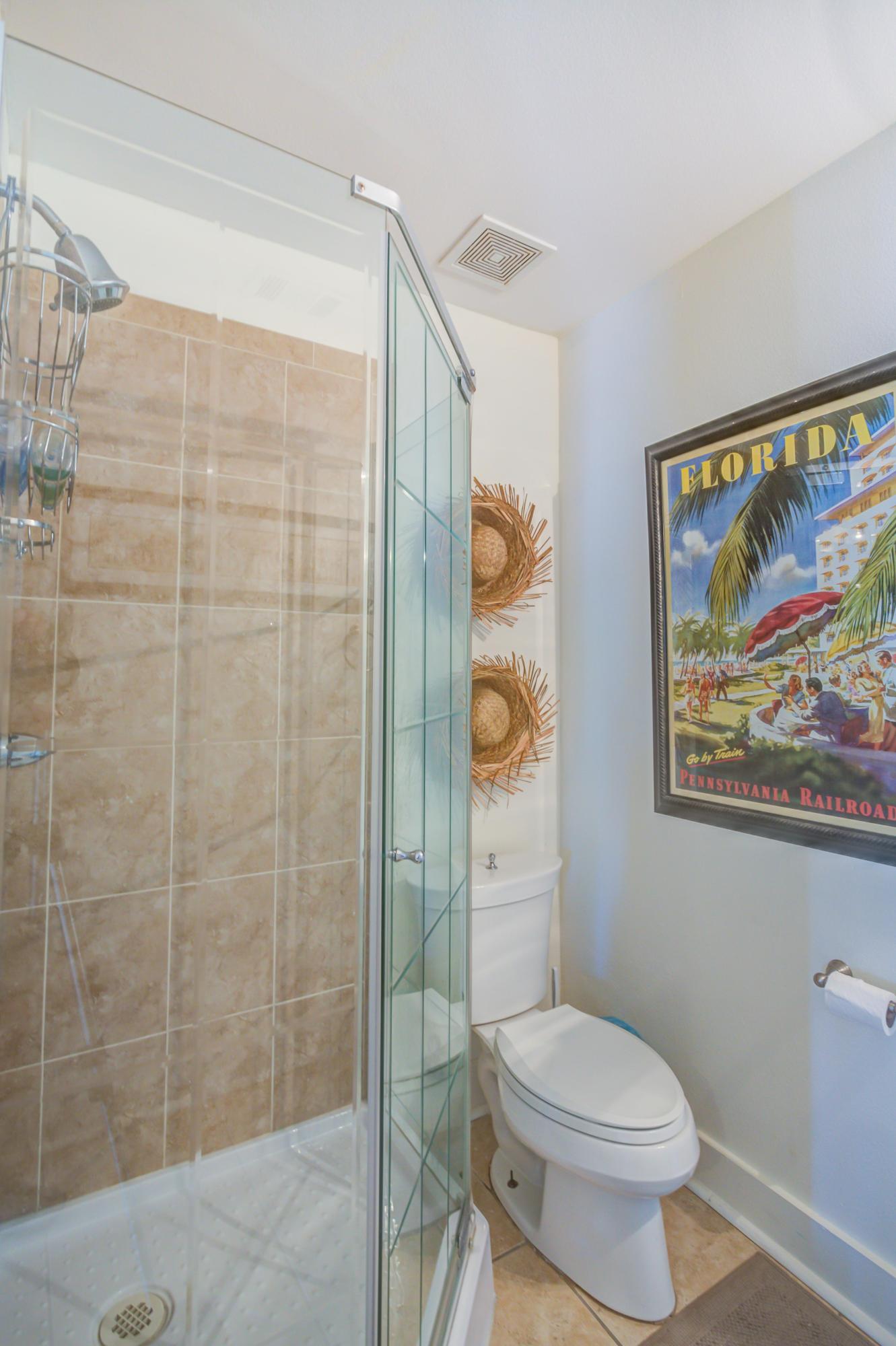 523 Gulf Shore Drive Destin, FL 32541 - Photo 55 of 78 a bathroom with a toilet and a shower