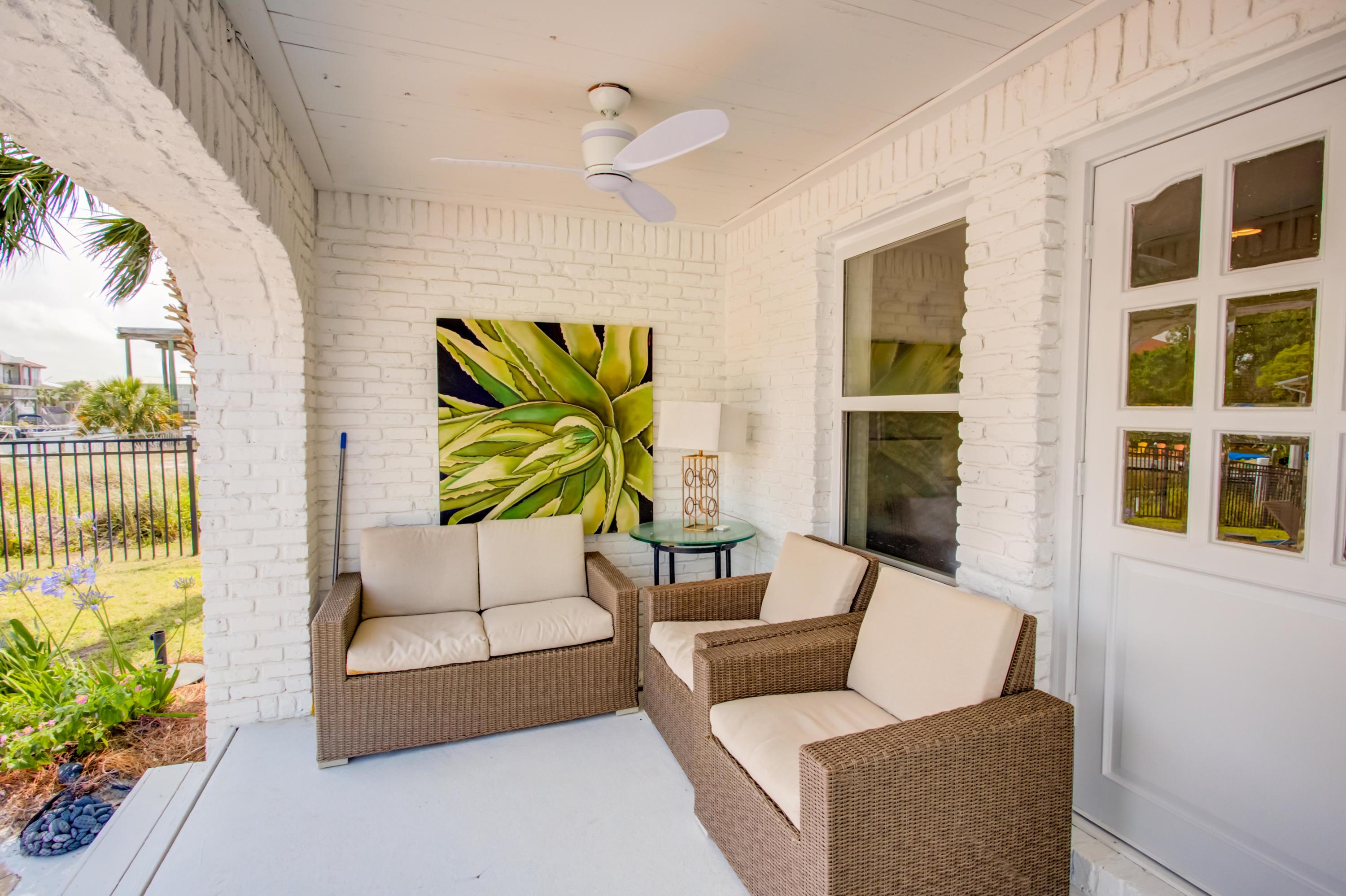 523 Gulf Shore Drive Destin, FL 32541 - Photo 58 of 78 a living room with furniture and a potted plant