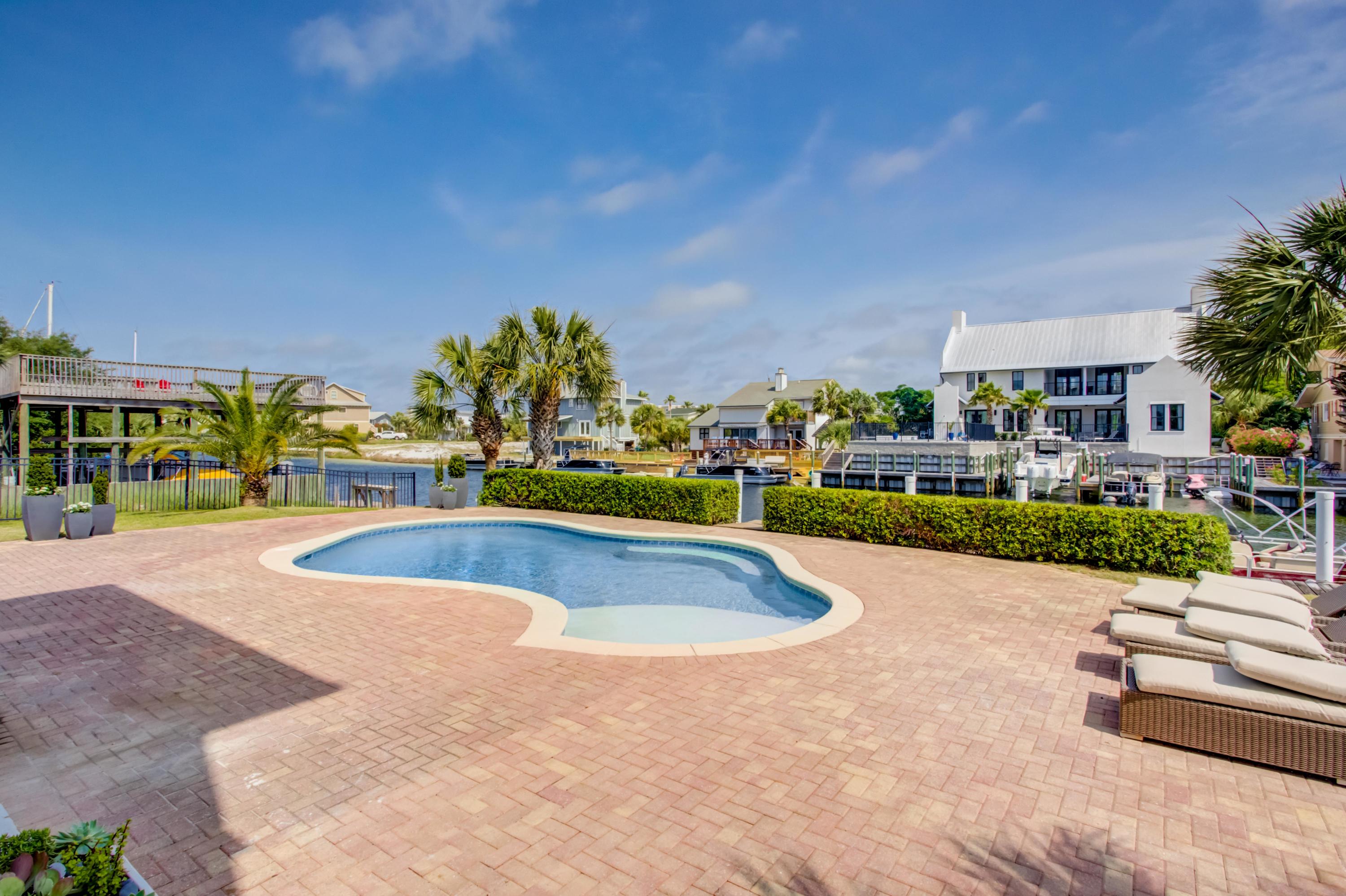 523 Gulf Shore Drive Destin, FL 32541 - Photo 63 of 78 a view of a swimming pool and a patio