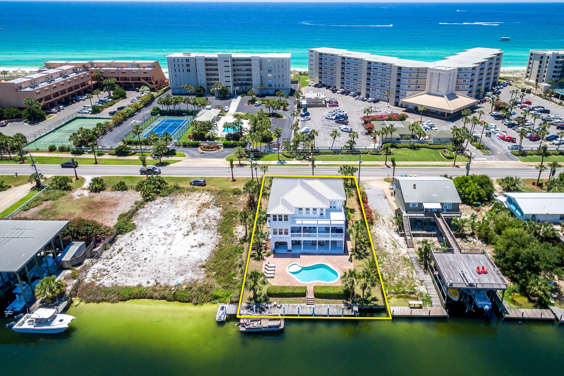 523 Gulf Shore Drive Destin, FL 32541 - Photo 69 of 78 an aerial view of a house with a garden and lake view