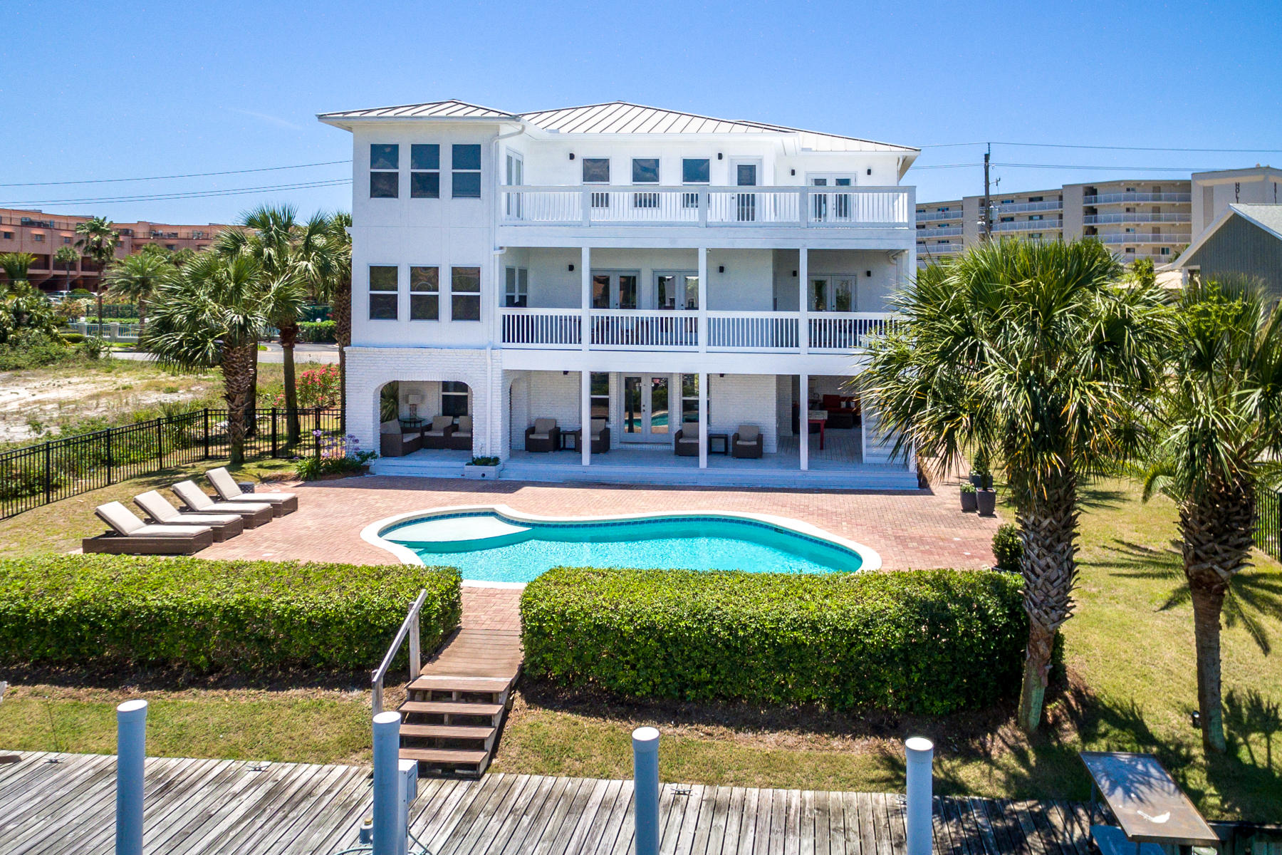 523 Gulf Shore Drive Destin, FL 32541 - Photo 78 of 78 a view of pool with lawn chairs and plants