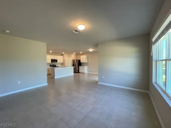 a view of a livingroom with furniture and windows
