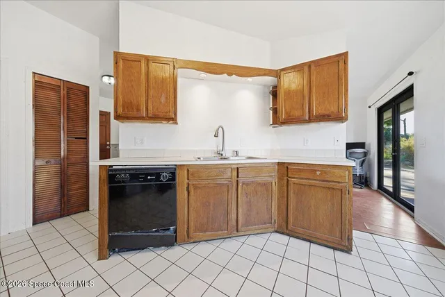 a kitchen with a refrigerator sink and microwave
