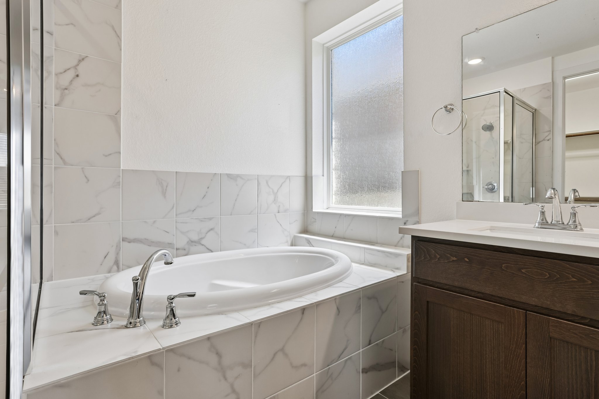 317 Independence Drive Kyle, TX 78640 - Photo 22 of 40 a bathroom with a sink and a bathtub