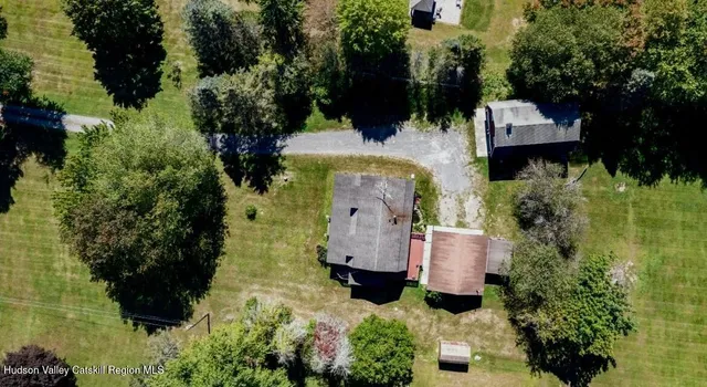 an aerial view of residential house with outdoor space