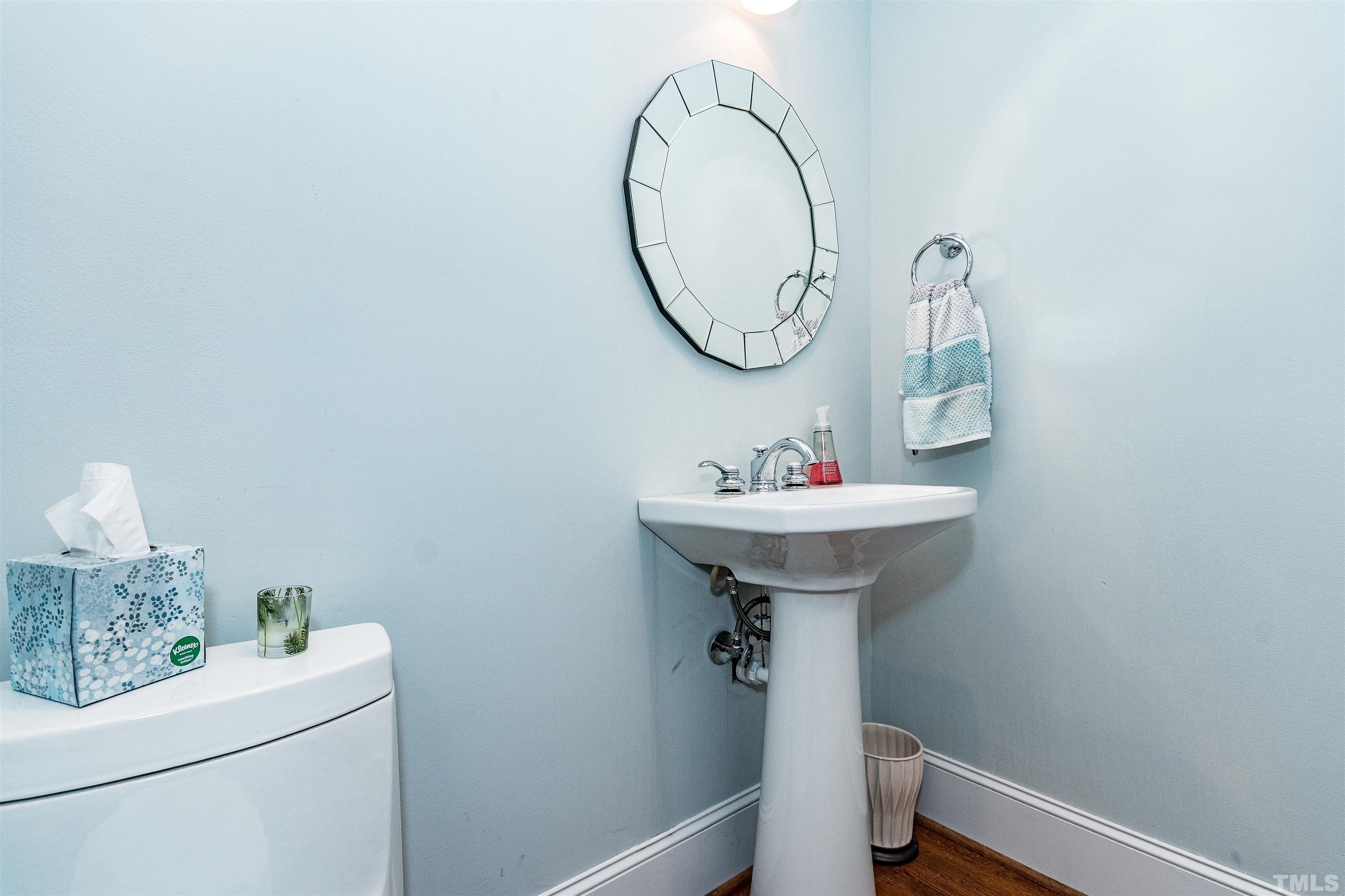 7631 Wellesley Park North Raleigh, NC 27615 - Photo 39 of 88 a bathroom with a sink a mirror and a toilet