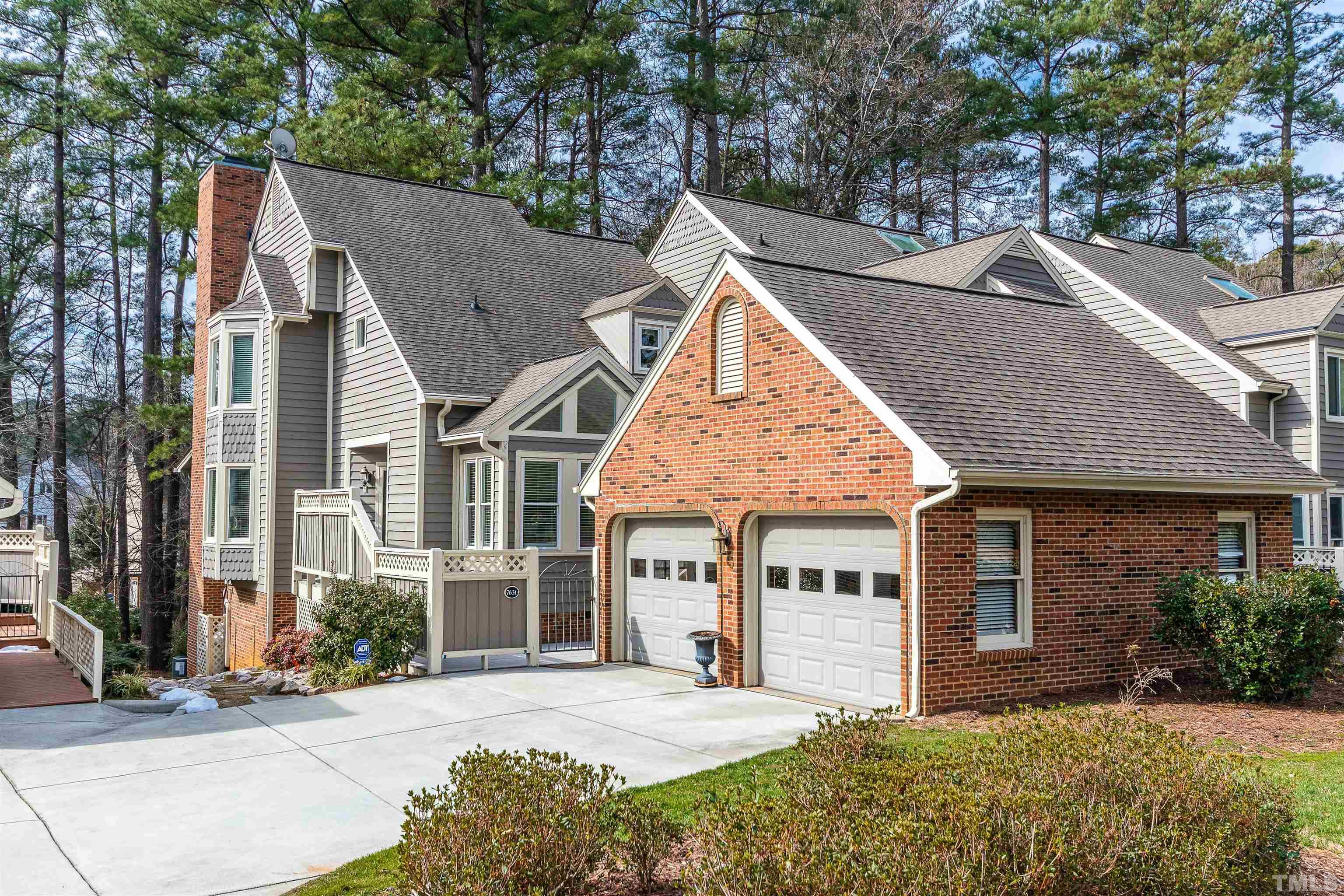 7631 Wellesley Park North Raleigh, NC 27615 - Photo 6 of 88 a view of a house with a yard and plants