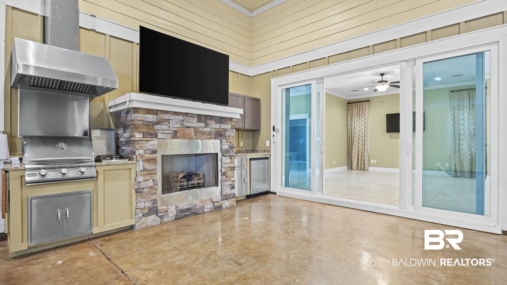 12361 Reunion Place Foley, AL 36535 - Photo 27 of 43 View of patio with an outdoor kitchen and a fireplace