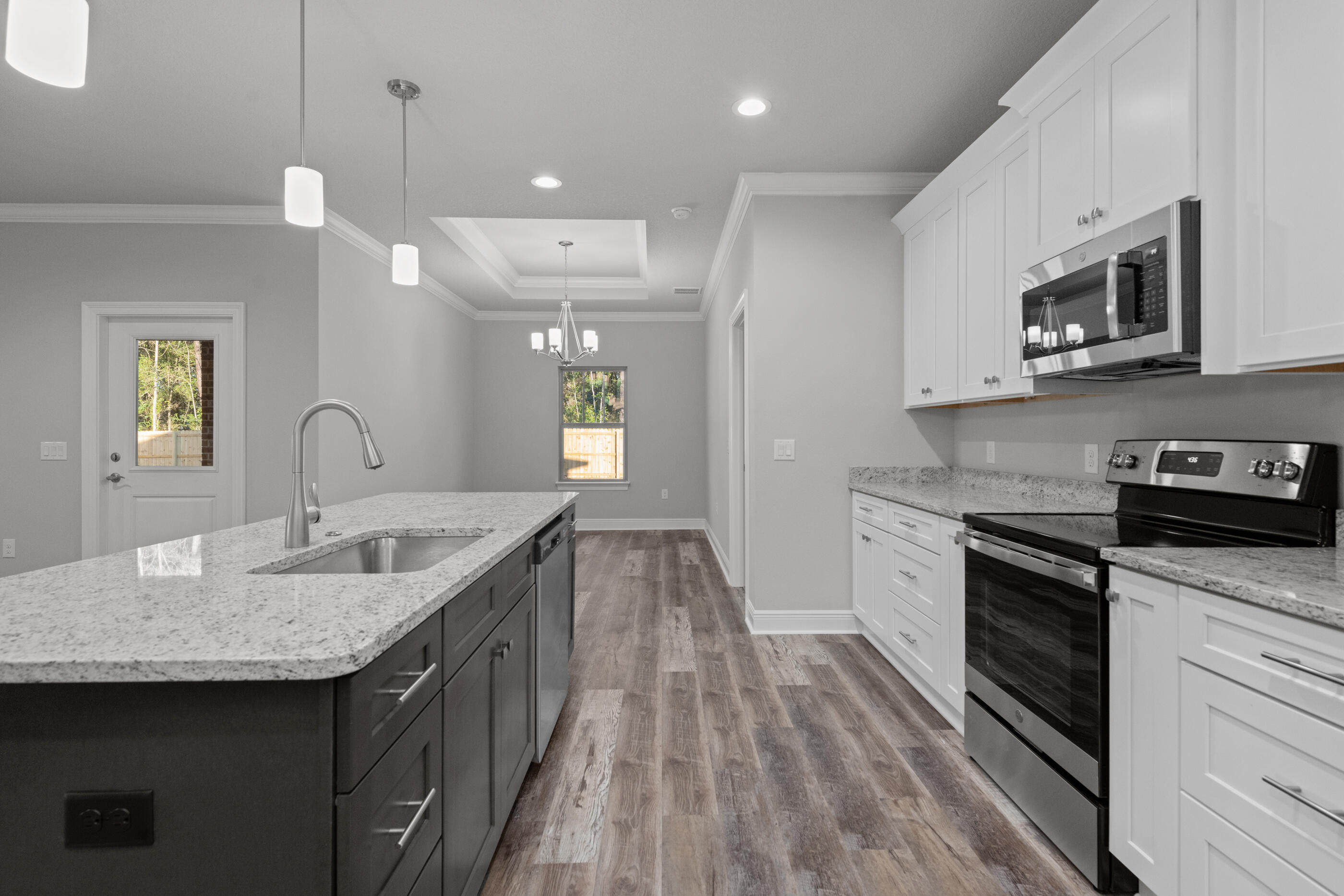 6699 Rocky Shores Road Milton, FL 32583 - Photo 17 of 75 a kitchen with sink stove and microwave