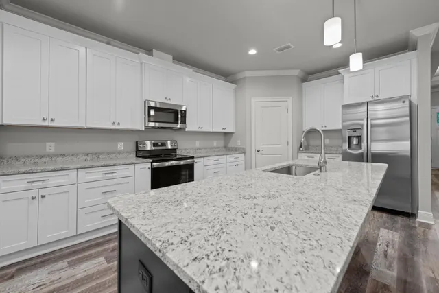 an empty room with a window and a ceiling fan