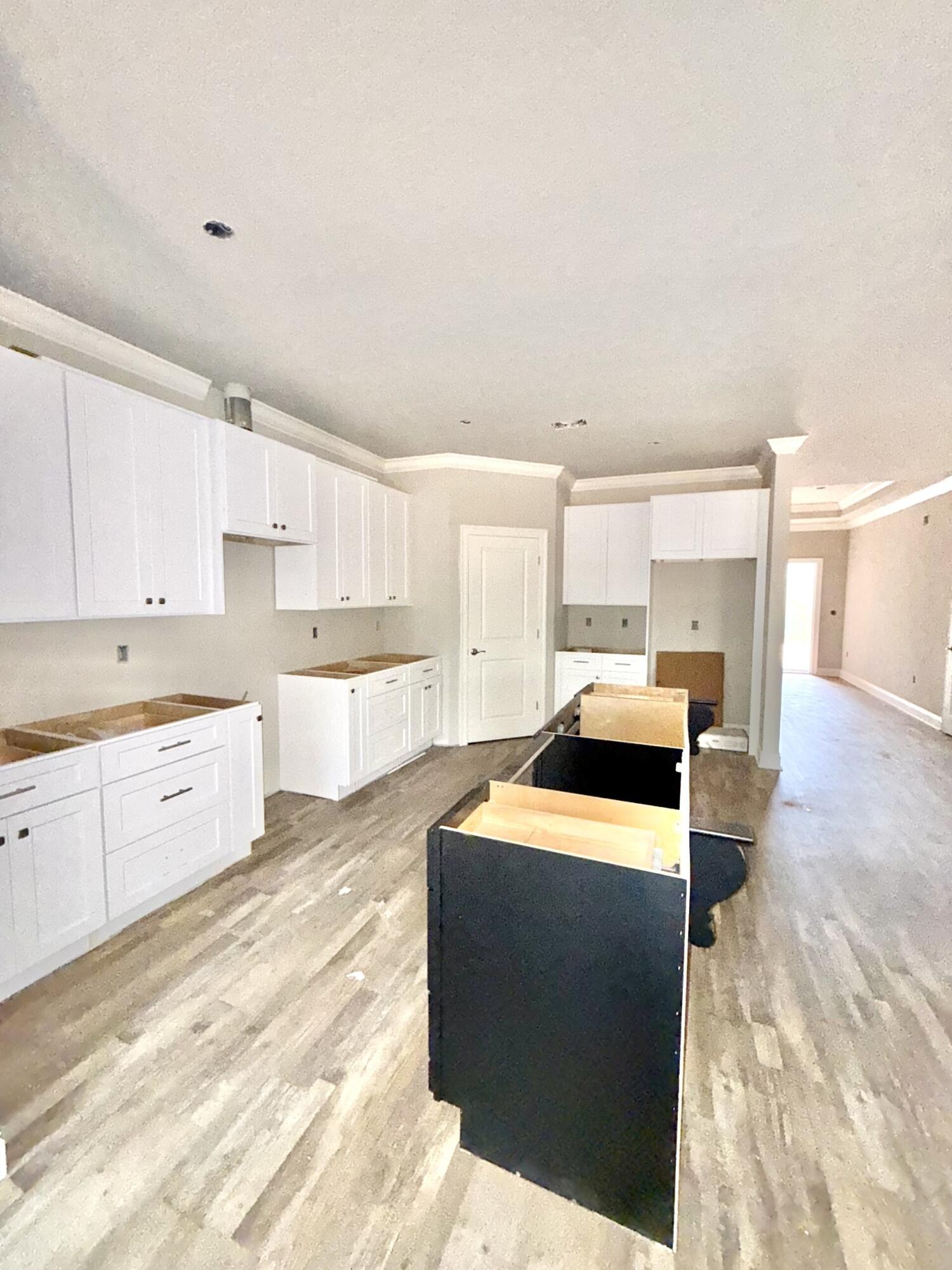 6699 Rocky Shores Road Milton, FL 32583 - Photo 21 of 75 a kitchen with a sink stove and cabinets