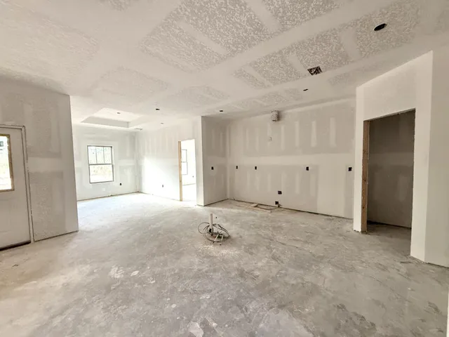 a bathroom with a granite countertop sink mirror and shower