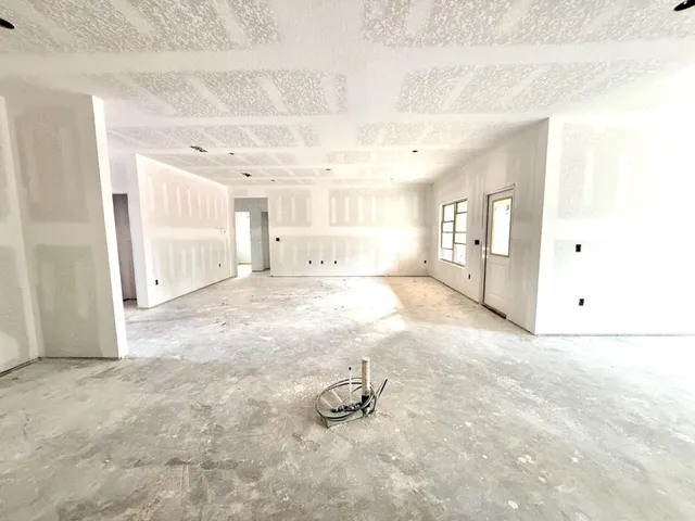 a bathroom with a tub shower and sink