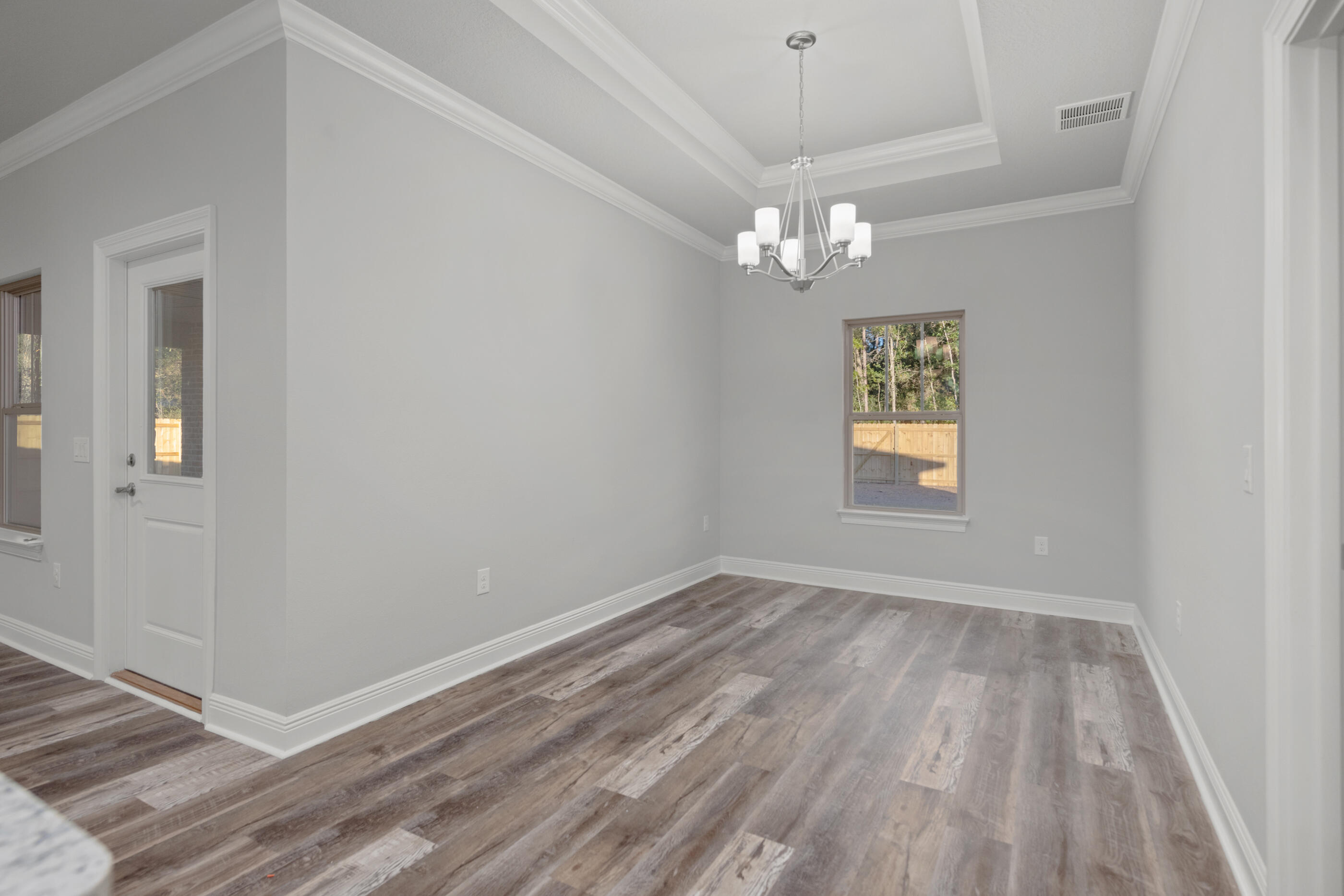6699 Rocky Shores Road Milton, FL 32583 - Photo 25 of 77 wooden floor in an empty room with a window