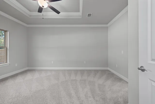 a bedroom with two large bed and a window