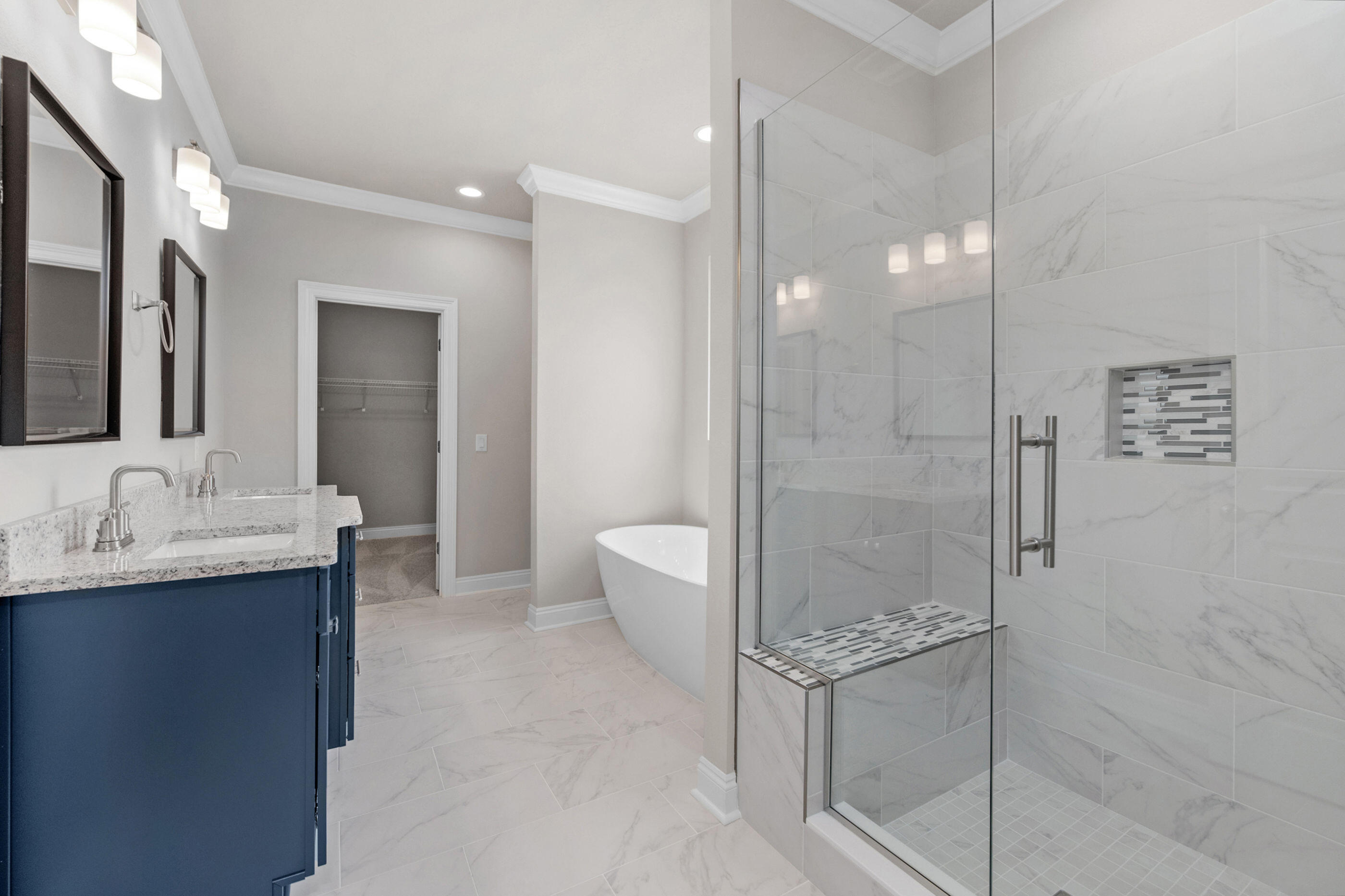 6699 Rocky Shores Road Milton, FL 32583 - Photo 37 of 77 a bathroom with a granite countertop sink mirror and shower