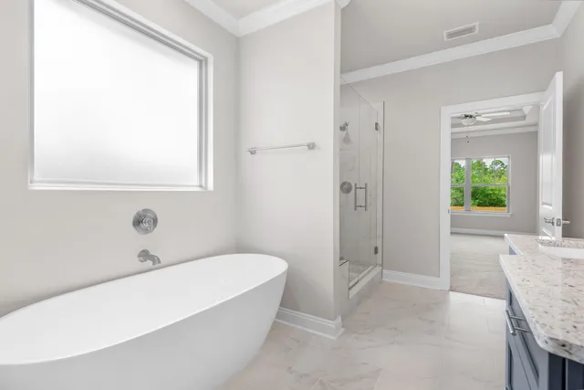 a bathroom with a granite countertop sink a toilet and mirror