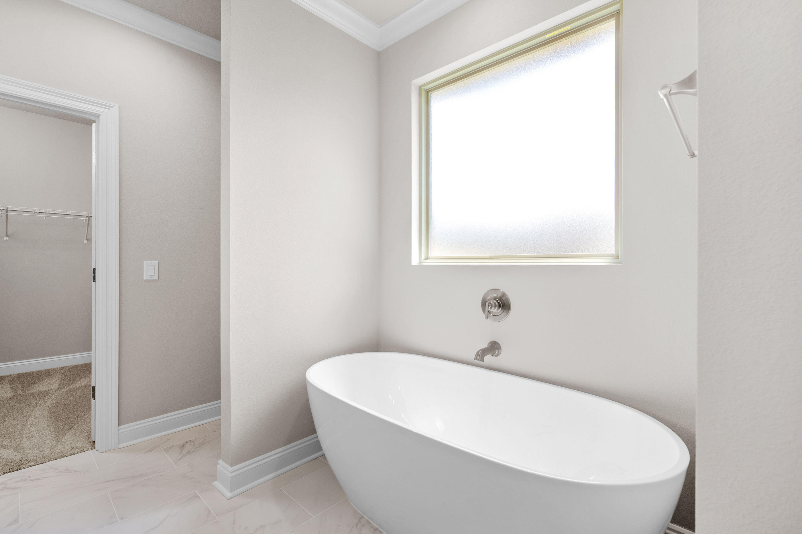 6699 Rocky Shores Road Milton, FL 32583 - Photo 44 of 77 a white bath tub sitting in a bathroom