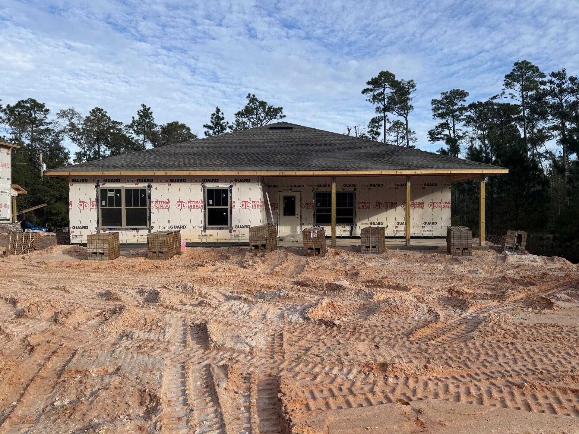 6699 Rocky Shores Road Milton, FL 32583 - Photo 72 of 75 front view of a house with a yard
