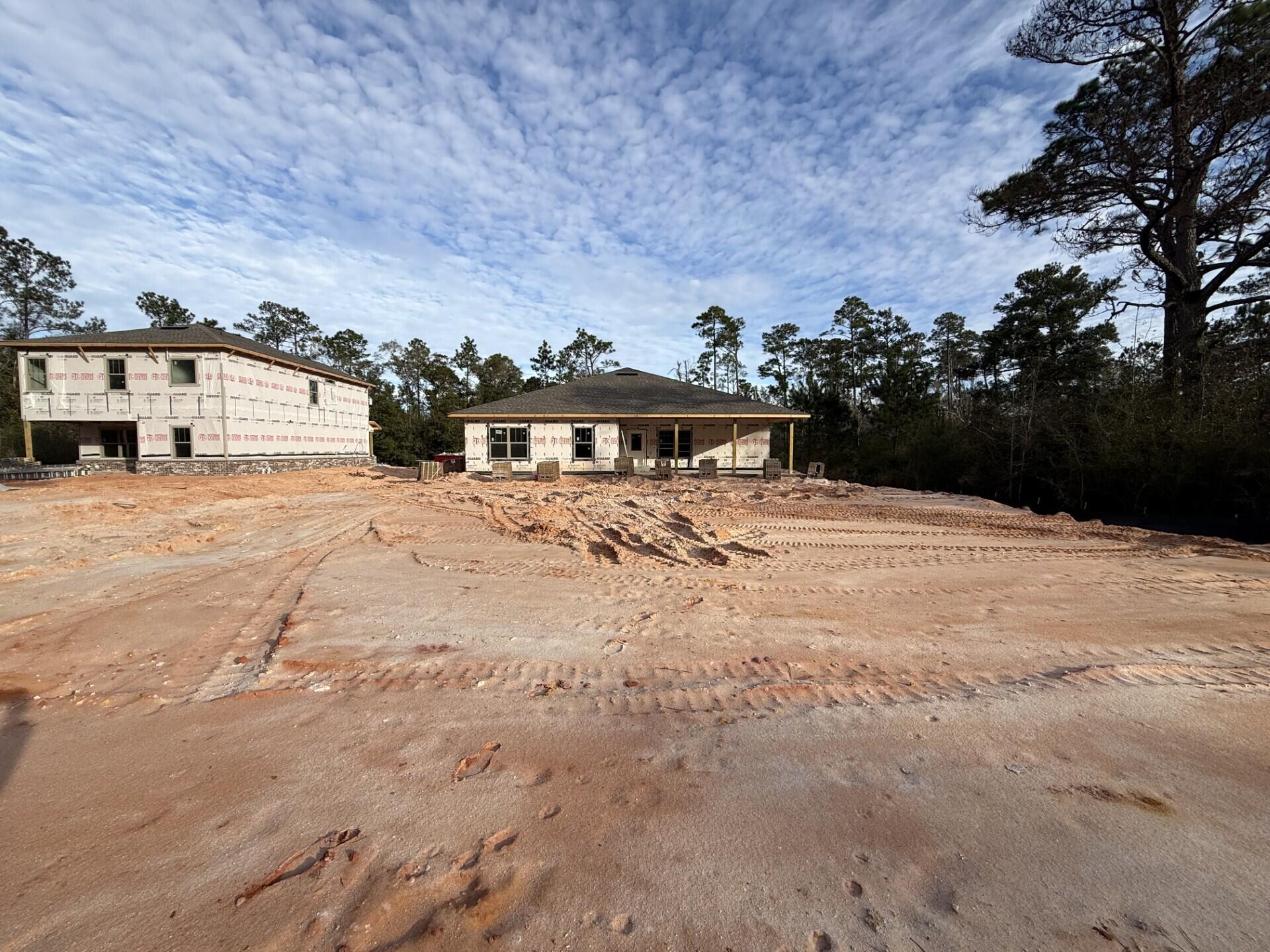 6699 Rocky Shores Road Milton, FL 32583 - Photo 76 of 77 a view of a house with a yard