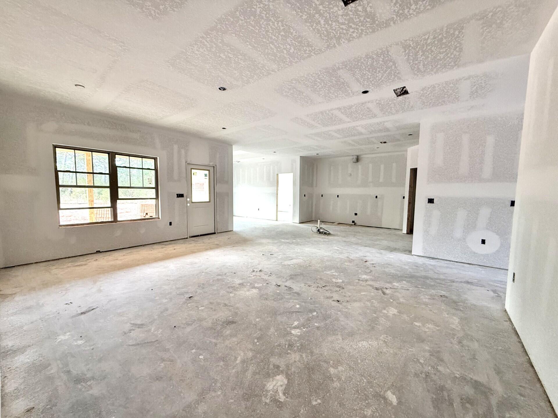6699 Rocky Shores Road Milton, FL 32583 - Photo 9 of 77 a view of empty room with windows and ceiling fan
