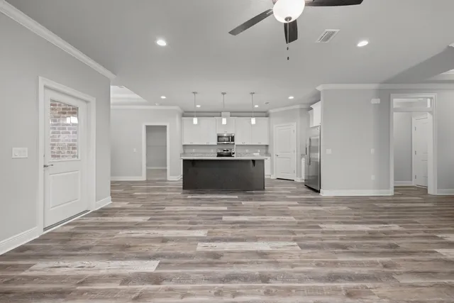 a kitchen with sink stove and microwave