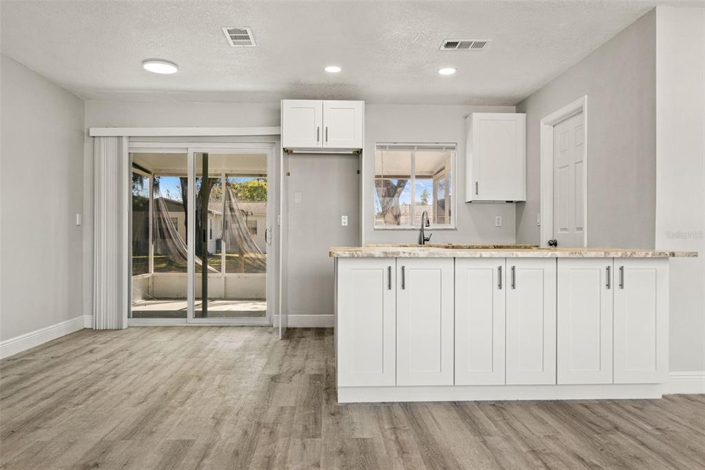 4030 Ligonier Road Spring Hill, FL 34608 - Photo 16 of 33 a kitchen with stainless steel appliances granite countertop a refrigerator and a sink
