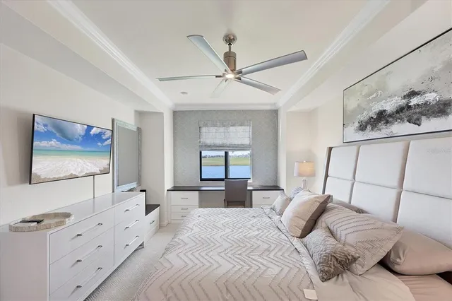 a bedroom with a bed and a chandelier