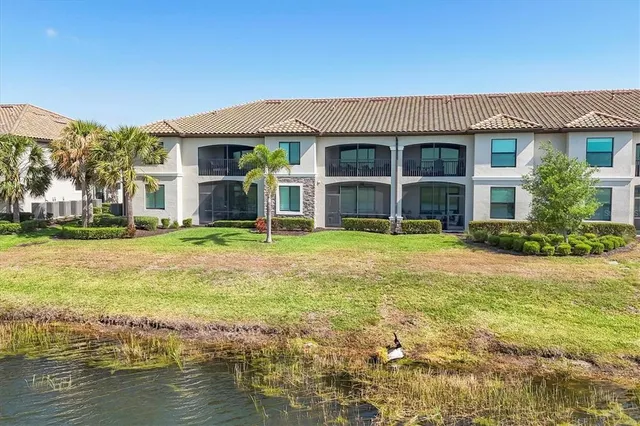 a living room with furniture wooden floor and a fireplace