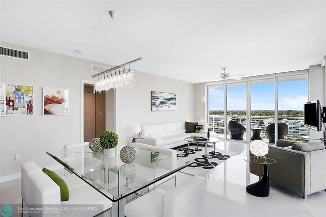a living room with lots of furniture and white walls