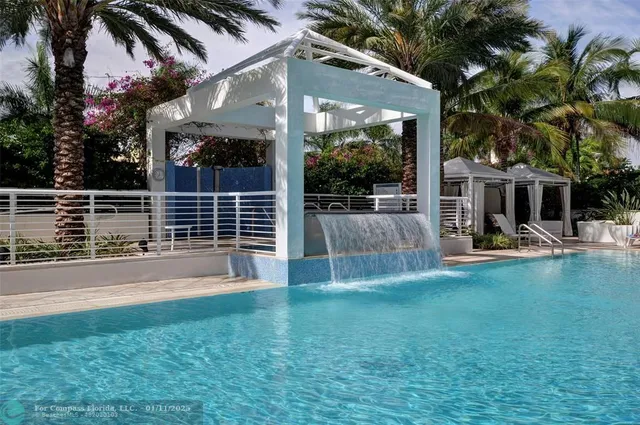 a view of a house with backyard and porch