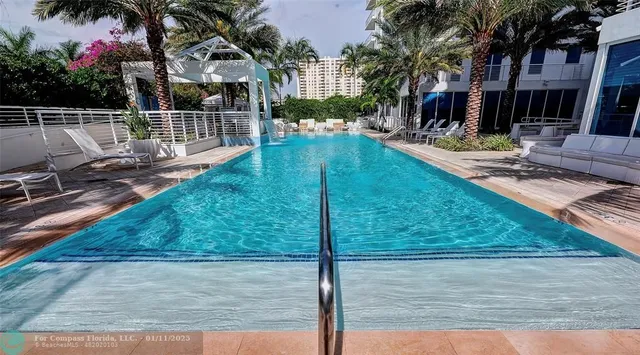 a view of a swimming pool with a patio