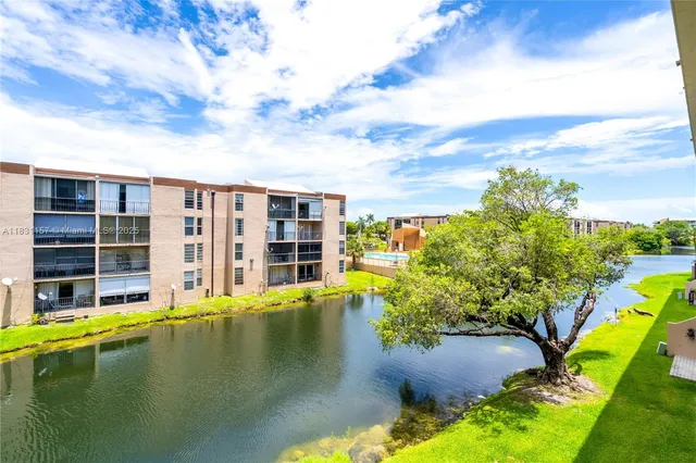 a swimming pool with outdoor seating and yard