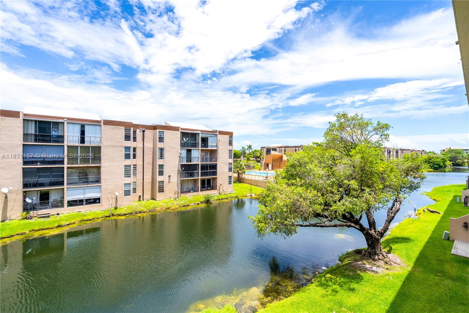 a swimming pool with outdoor seating and yard