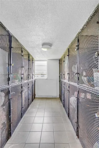 a kitchen with a sink a counter top space and cabinets