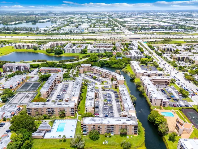 an aerial view of residential building and lake