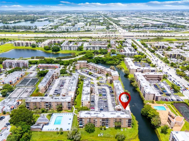 an aerial view of residential building and lake