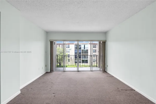 a view of a room with floor to ceiling window