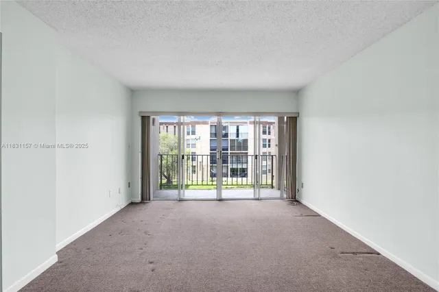 a view of a room with floor to ceiling window