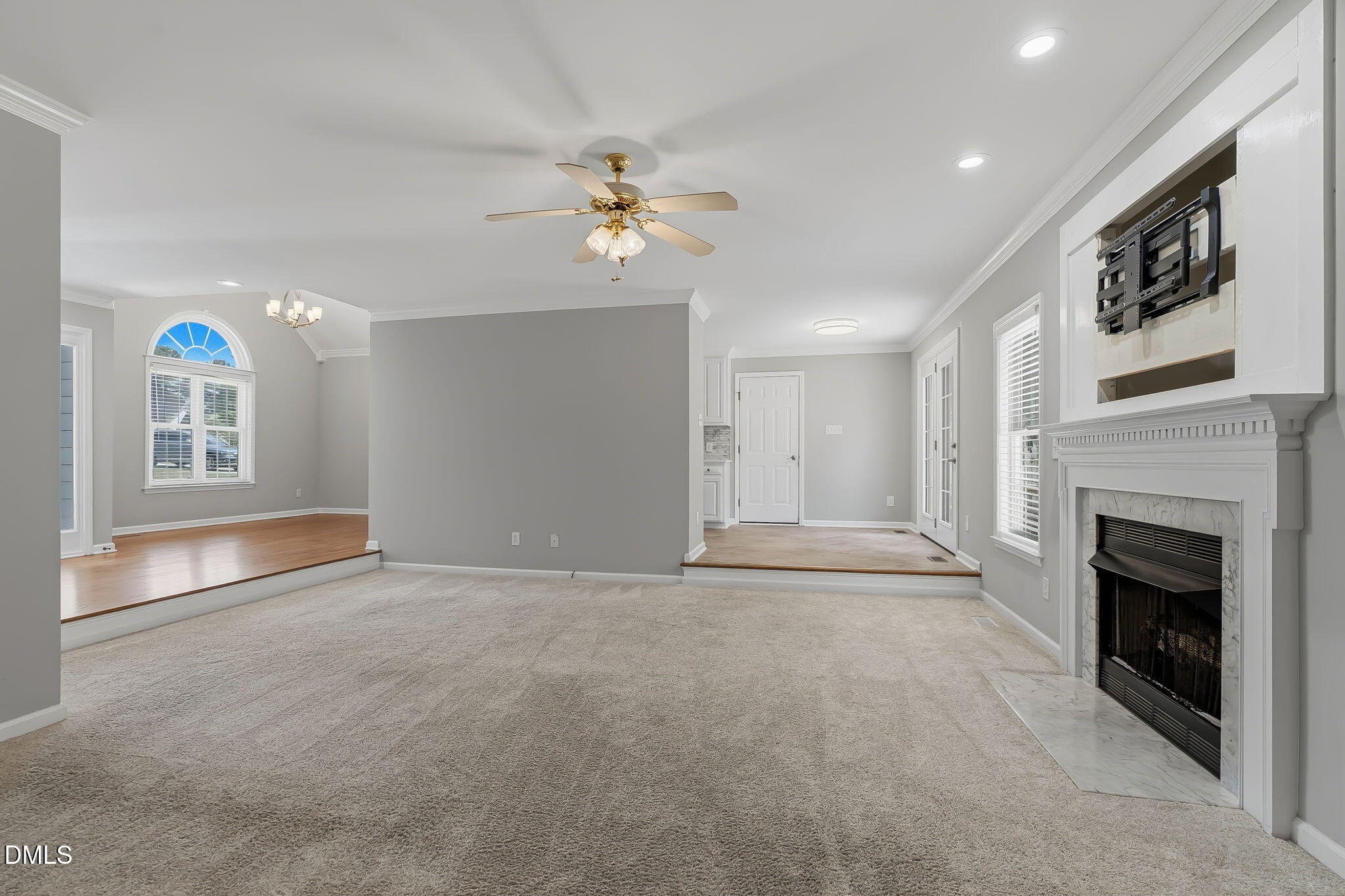 1112 Tyler Farms Drive Raleigh, NC 27603 - Photo 17 of 78 a view of an empty room with a fireplace